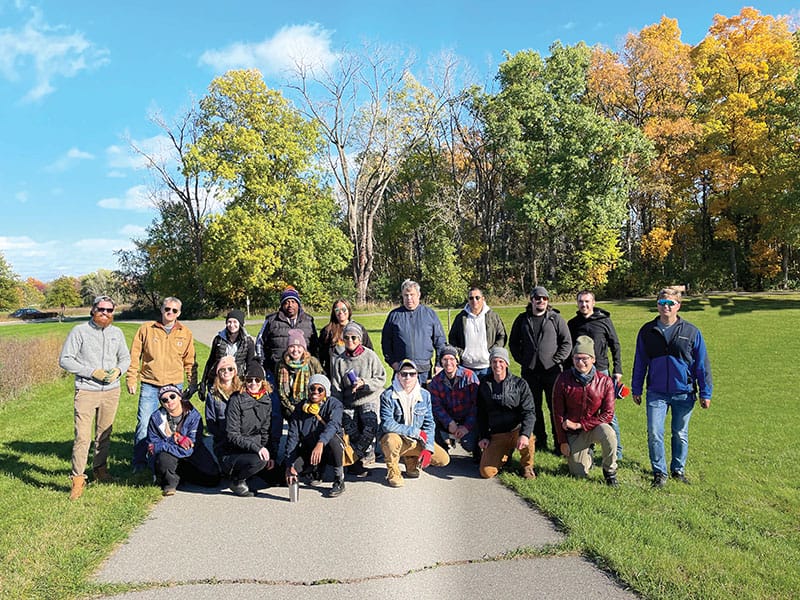 Nutshell members posing for a picture in a park